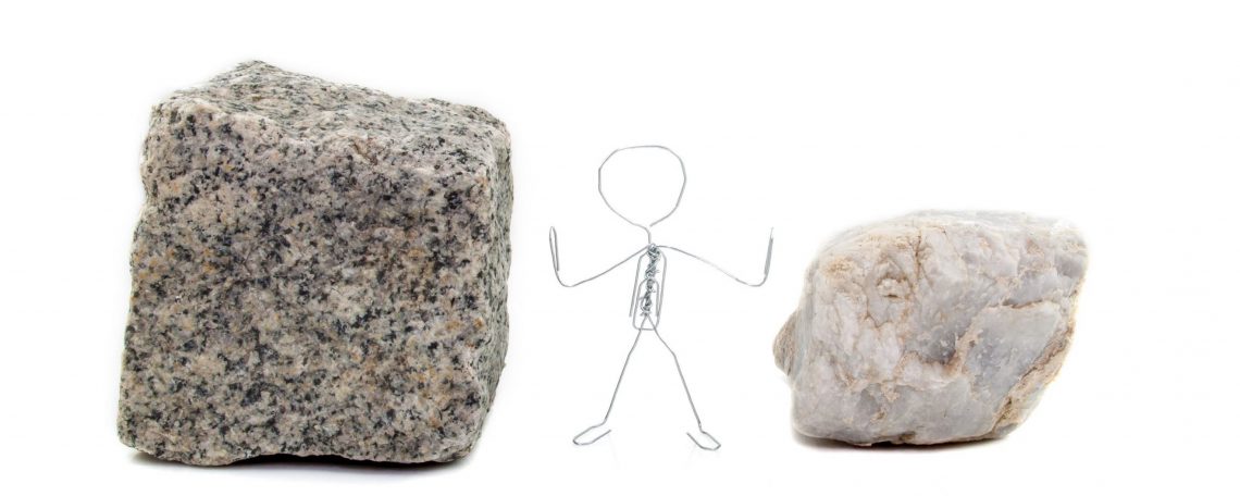 a stick figure stands between a rock and a hard place