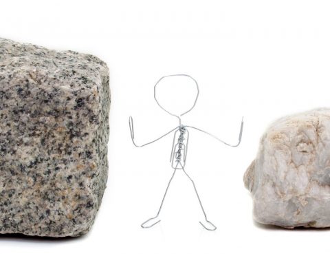 a stick figure stands between a rock and a hard place