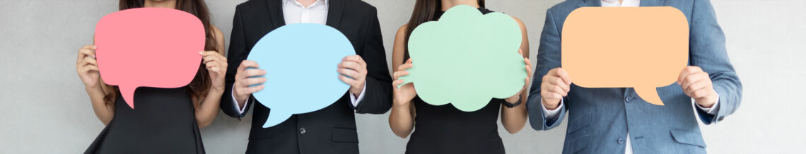 People holding colorful Speech Bubbles.