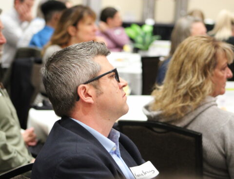 Guest listens to 2023 Spring Candidate Forum