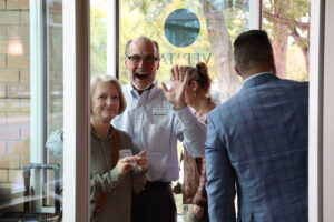 Excited people entering door