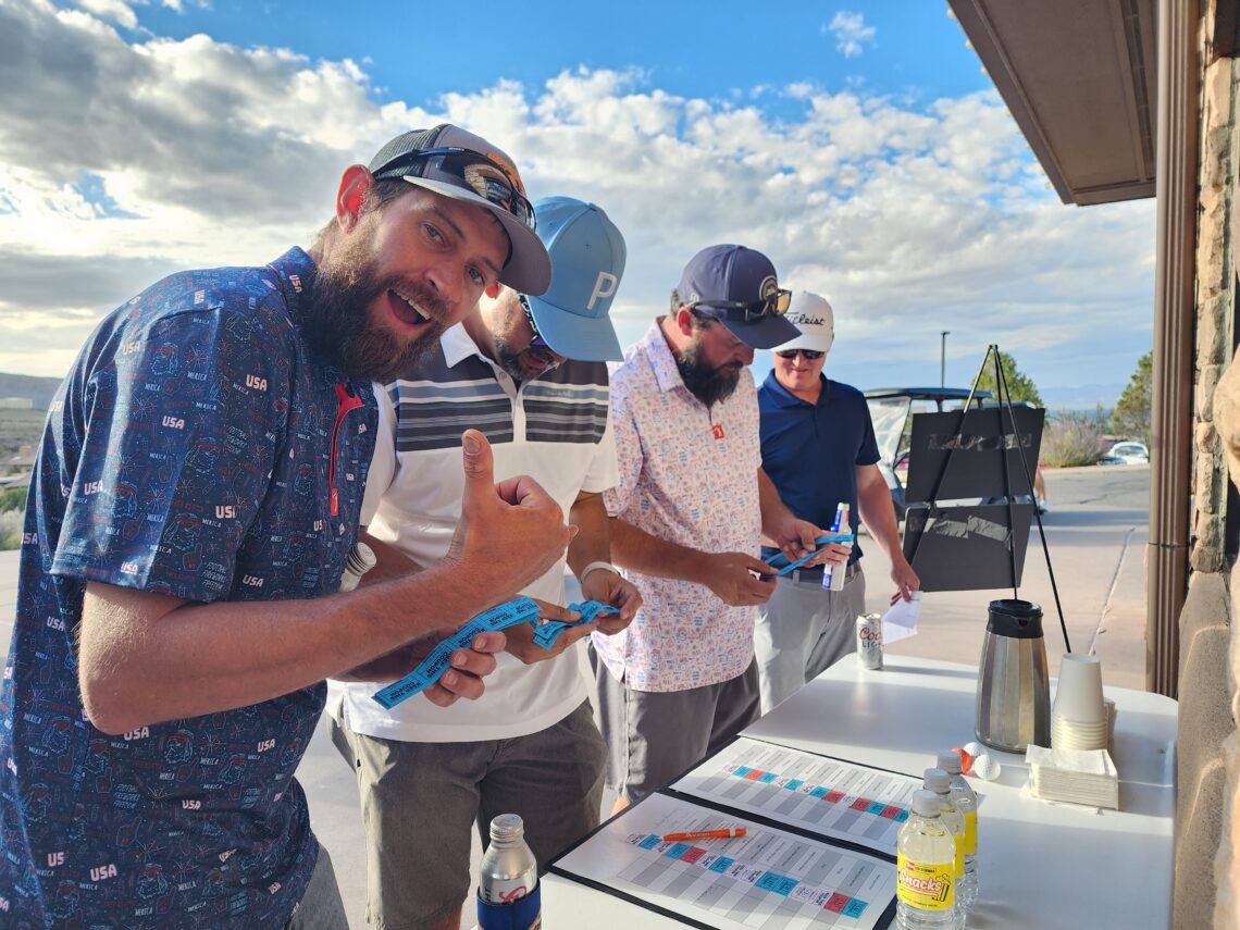 Grand Junction Area Chamber of Commerce Golf Tournament at Redlands Mesa Golf Course and attendees enjoying the activities