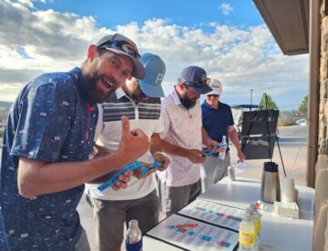 Grand Junction Area Chamber of Commerce Golf Tournament at Redlands Mesa Golf Course and attendees enjoying the activities