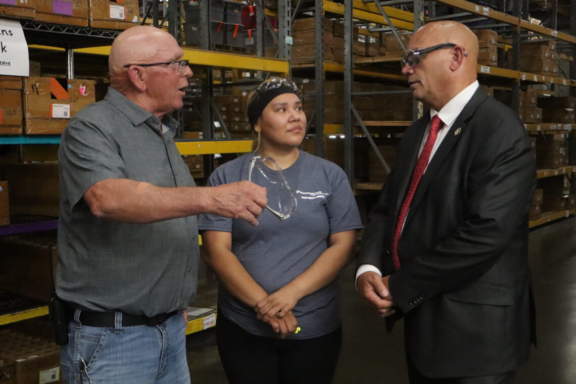 National Director of Workforce Initiatives Troy Selberg with employees at Innovative Textiles
