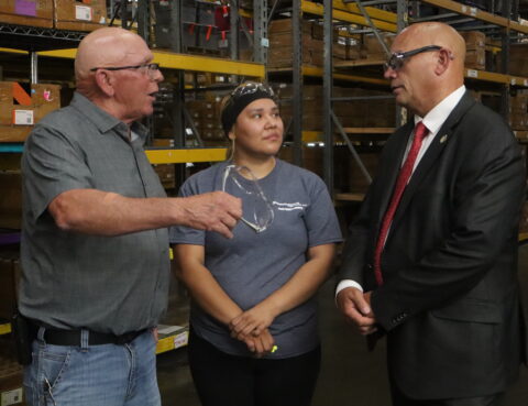 National Director of Workforce Initiatives Troy Selberg with employees at Innovative Textiles