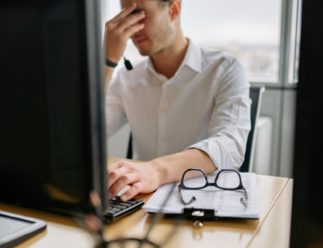 Worker expresses stress at this desk